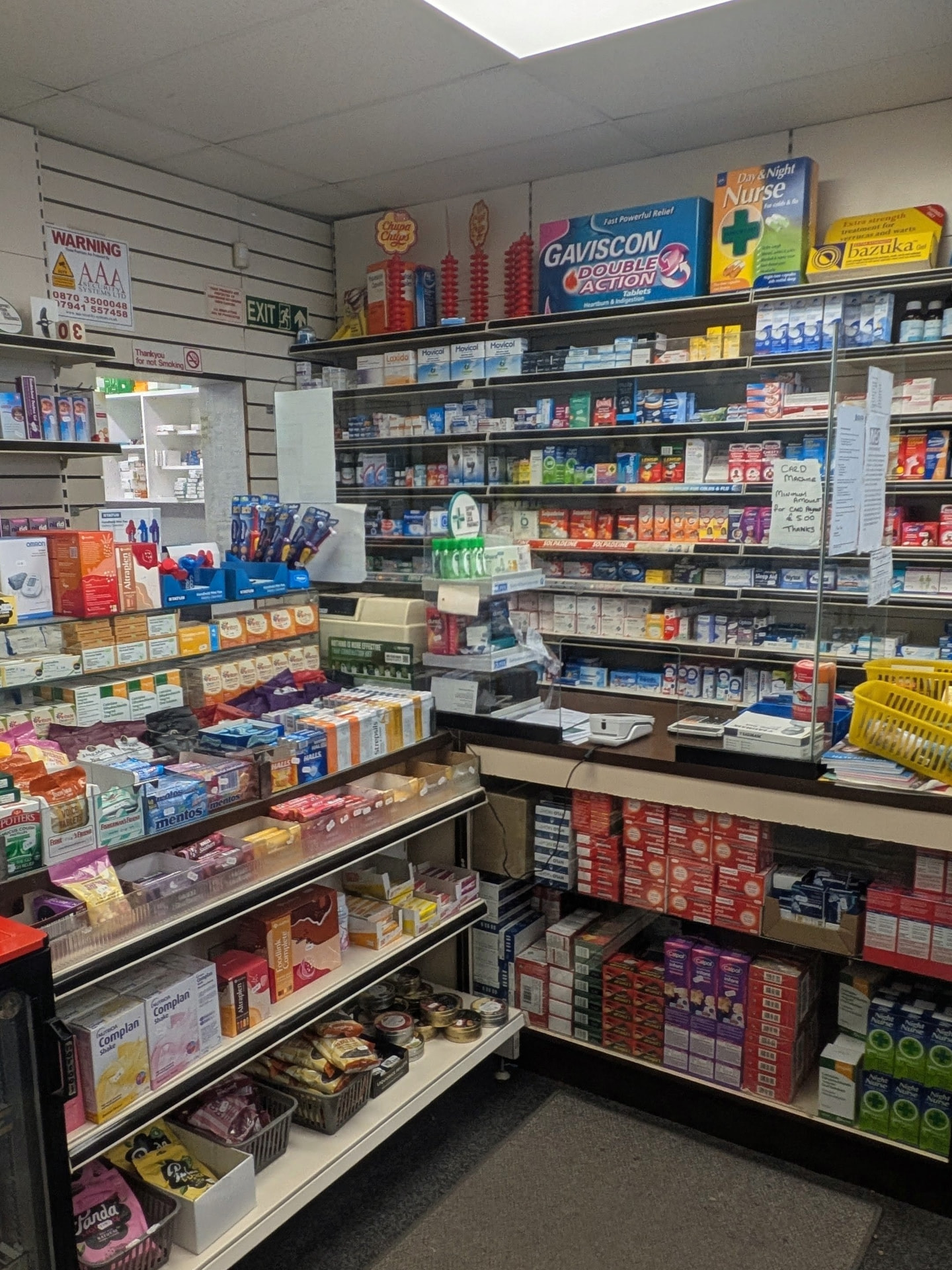 The dispensing counter and over the counter medicine shelves at Panchem Pharmacy