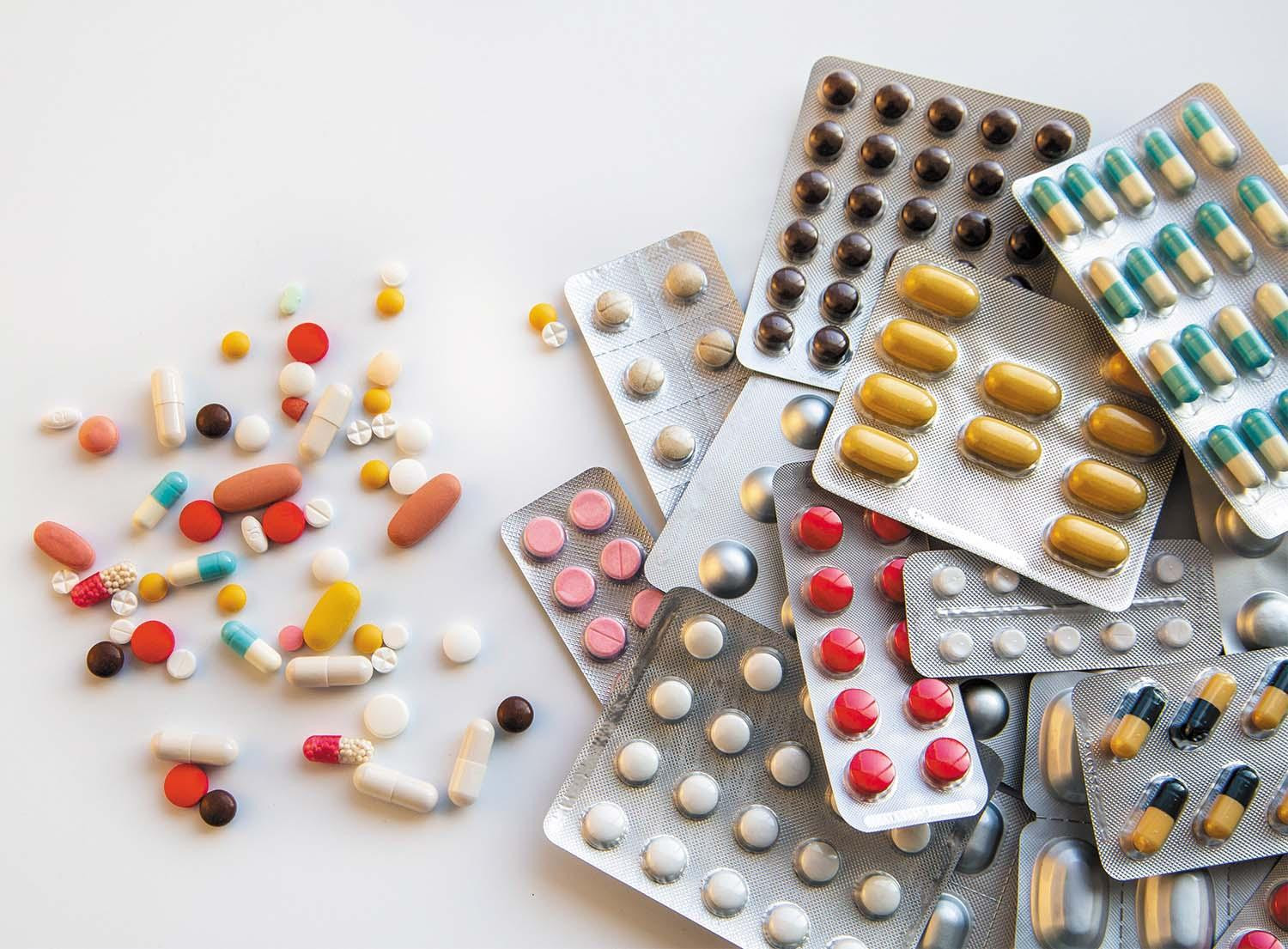 Blister packs of prescription medication laid out on a light surface