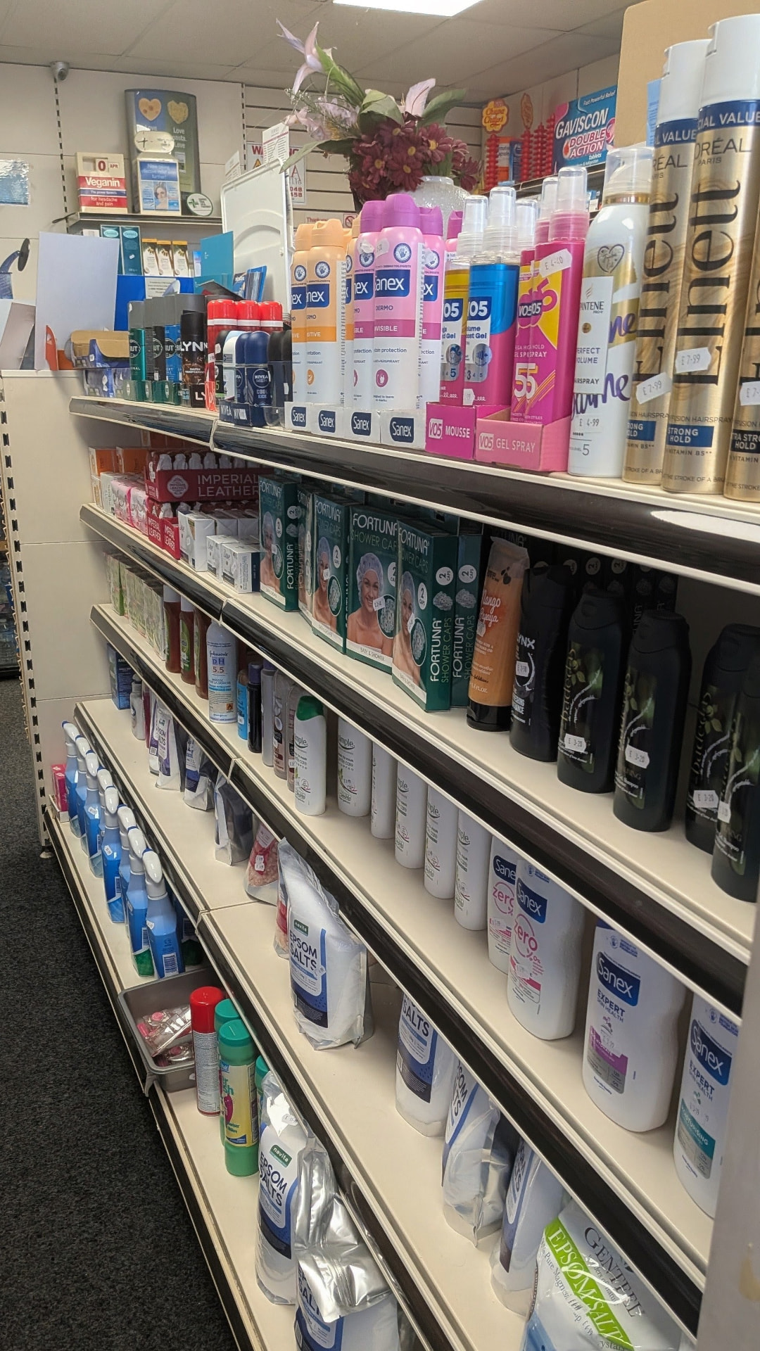 Toiletries and bathing products on a shelving unit in the pharmacy