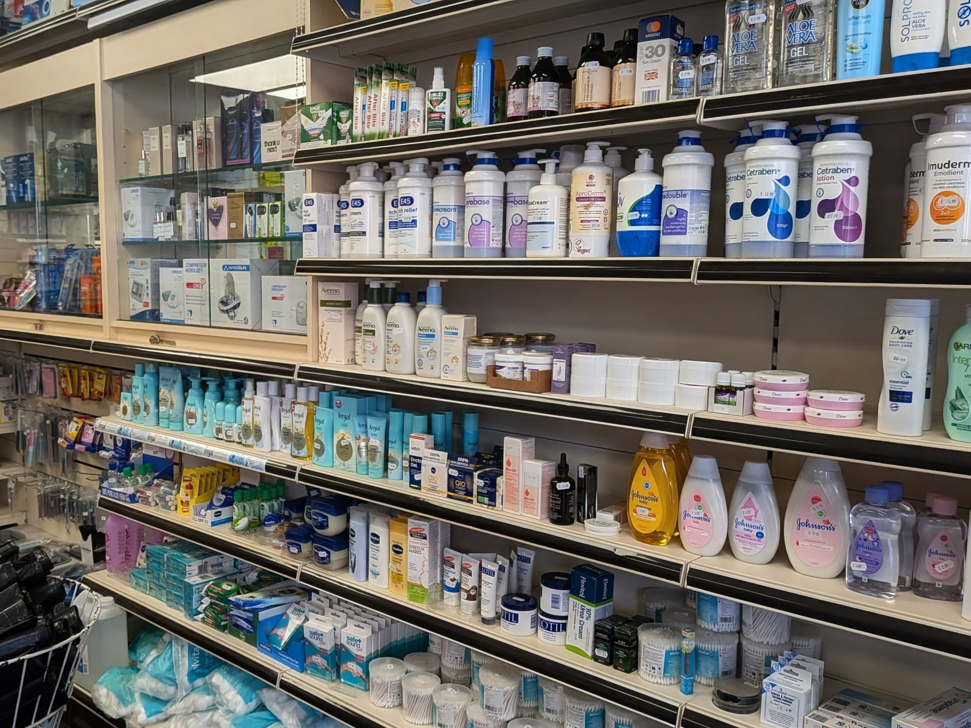 Skincare, emollients and sun care products on the pharmacy shelves